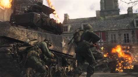 Call of Duty WWII játékban lévő katonák, a háttérben harci jelenet