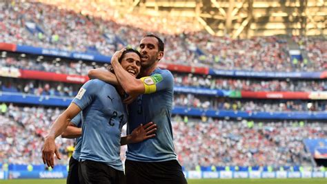 Edinson Cavani és Diego Godín dedikál