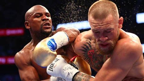 Floyd Mayweather és Conor McGregor a mérlegelésen