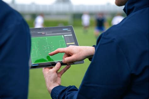 Digital tablet showing live football statistics
