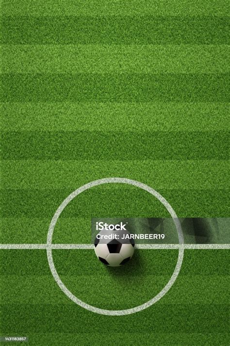 Futballpálya és focisták körben, elmosódott háttérrel