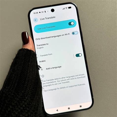 Mobiltelefon képernyője élő sporteredményekkel