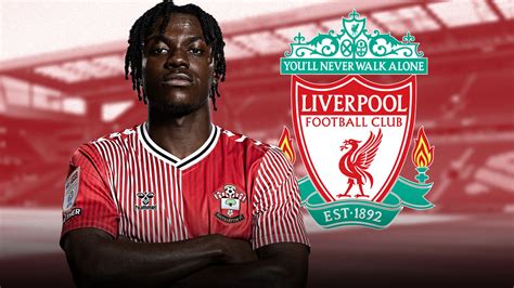 A Liverpool FC címere a Shankly-kapukkal és fáklyákkal